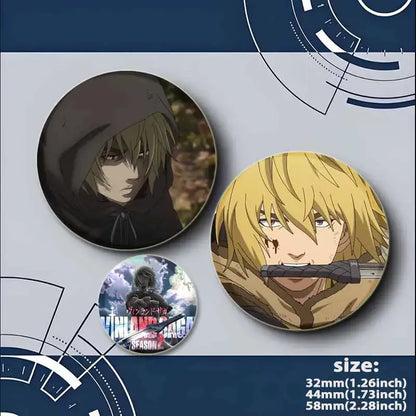 Vinland saga badge pin featuring handmade tinplate brooch with hooded figure and blonde character holding sword designs