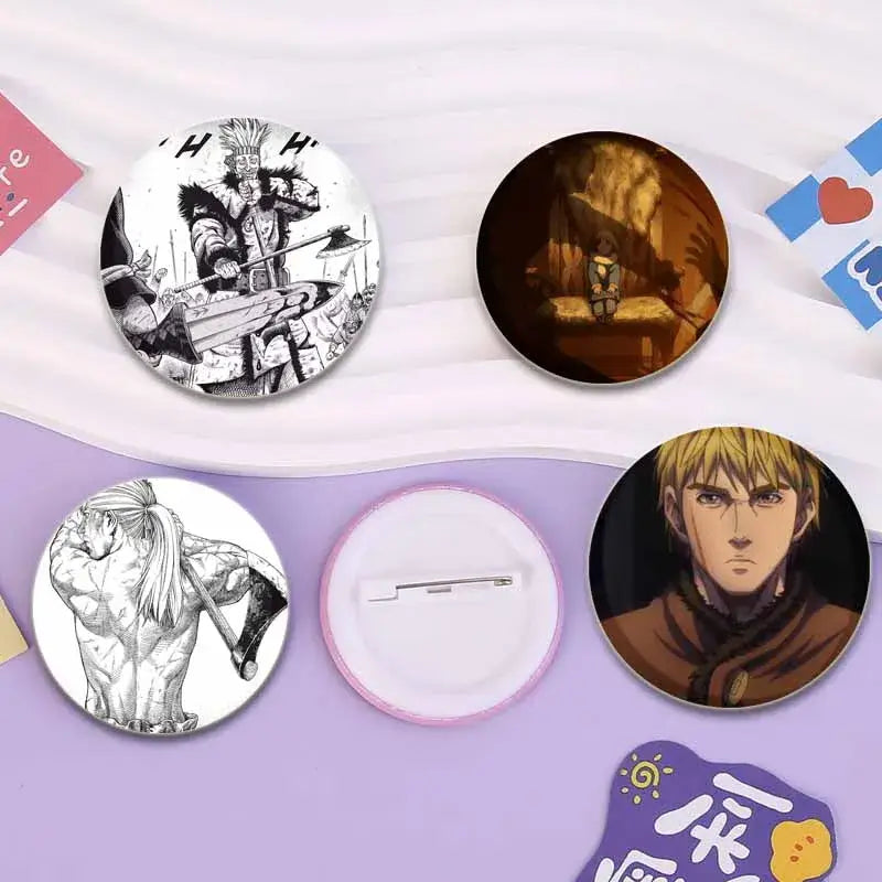 Handmade tinplate vinland saga badge pin featuring circular anime and manga character designs in color and black and white