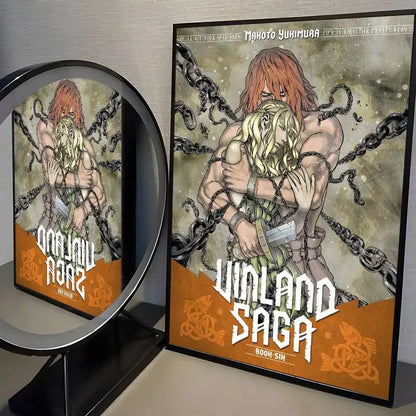 Black-framed vinland saga manga poster with orange-haired man and blonde woman in chains wall art for decor