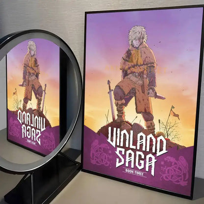 Framed vinland saga manga poster featuring white-haired anime character against vibrant purple and orange sunset wall art