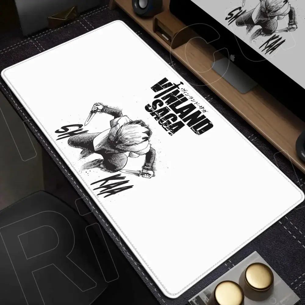 White rectangular vinland saga desk mat featuring black-and-white kuma illustration with bold ink-stroke mouse pad design