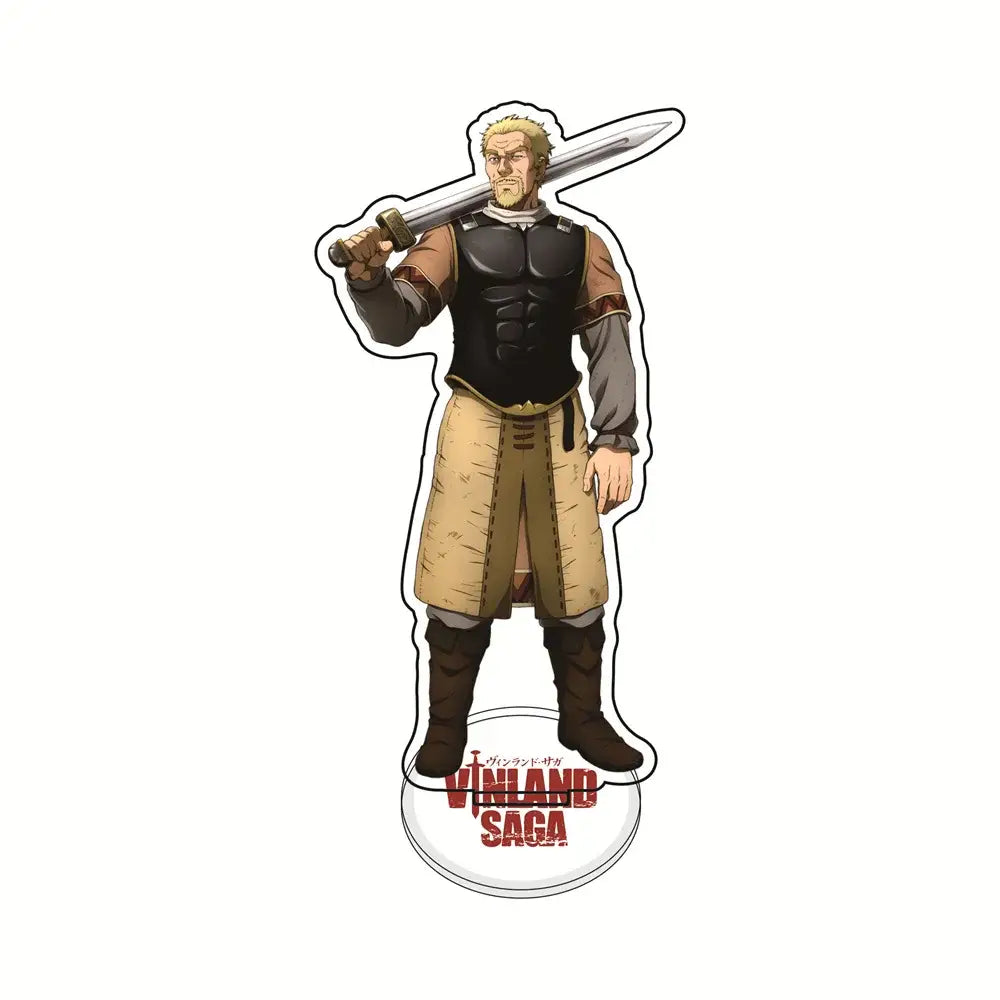 A clear acrylic vinland saga thorfinn acrylic stand featuring a muscular blonde warrior in black armor holding a sword