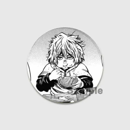 Circular black-and-white vinland saga thorfinn button brooch featuring a manga-style spiky-haired anime character illustration
