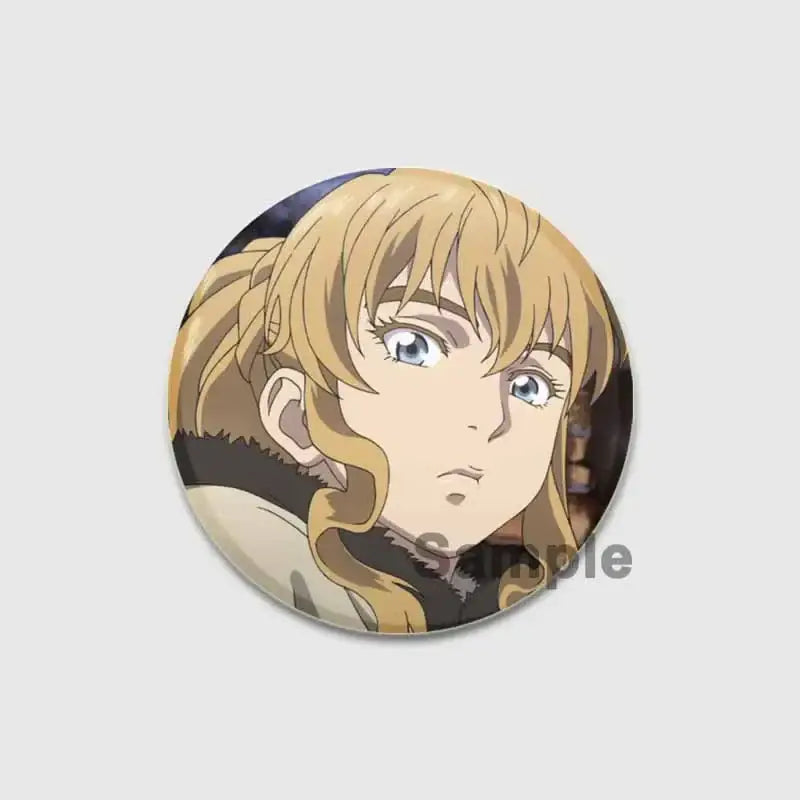 Circular vinland saga thorfinn button brooch featuring detailed illustration of blonde anime character on tinplate badge