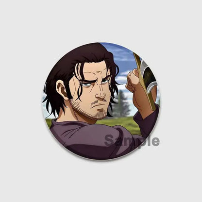 Circular tinplate vinland saga thorfinn button brooch with dark hair anime character in purple shirt holding a sword