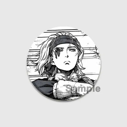 Circular black-and-white vinland saga thorfinn button brooch featuring anime character with long hair and headband