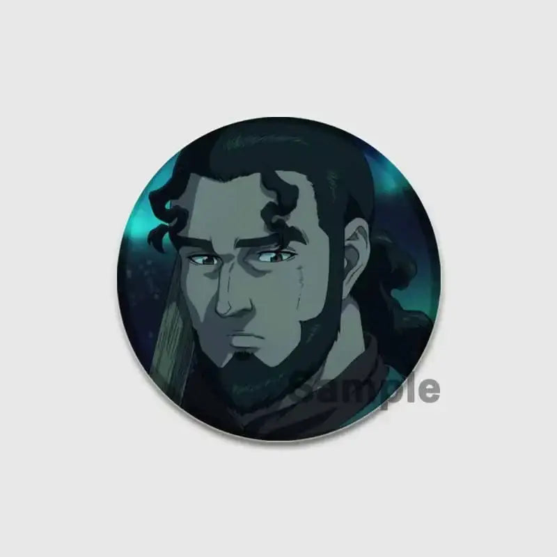 Circular vinland saga thorfinn button brooch with a bearded man illustration on teal and black tinplate soft badge