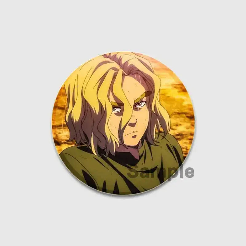 Circular vinland saga thorfinn button brooch with anime character in green tunic on warm orange tinplate badge