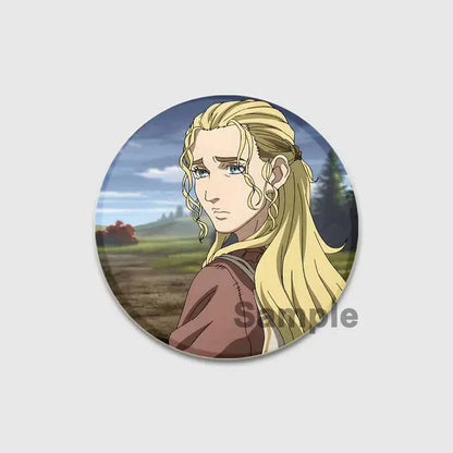 Circular vinland saga thorfinn button brooch featuring detailed anime character with blonde hair and blue eyes on scenic background