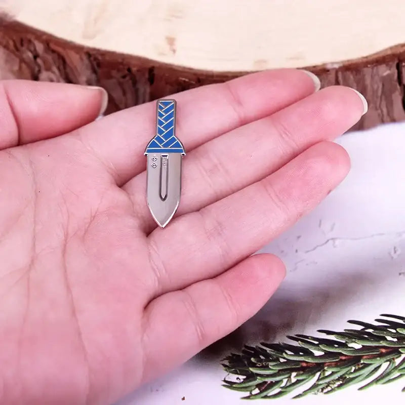 Vinland saga thorfinn dagger enamel pin in silver and blue hard enamel with a braided hilt design