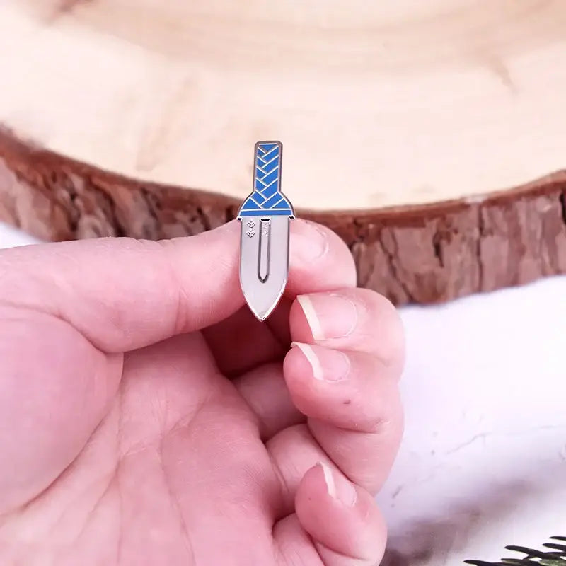 Vinland saga thorfinn dagger enamel pin in silver and blue hard enamel with a stylized knife braided handle design