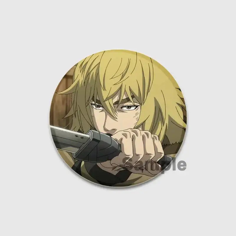 Circular vinland saga thorfinn enamel pin featuring blonde anime character gripping sword made of coated metal or plastic