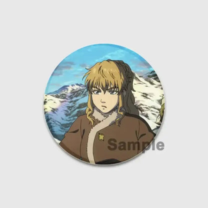 Circular vinland saga thorfinn enamel pin featuring blonde anime character in brown coat with snowy mountain background