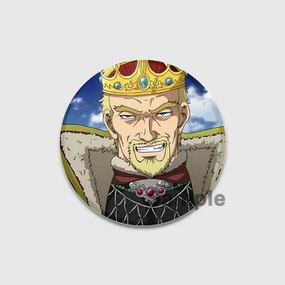 Circular vinland saga thorfinn enamel pin featuring anime-style king with gold jeweled crown on black chainmail tunic