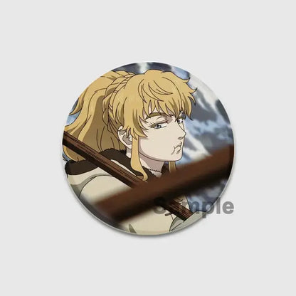 Circular handmade vinland saga thorfinn enamel pin featuring a detailed blonde anime character with a determined expression