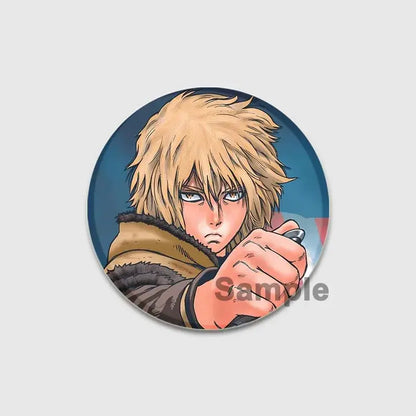 Circular vinland saga thorfinn enamel pin featuring anime character with spiky blonde hair in brown fur-lined coat