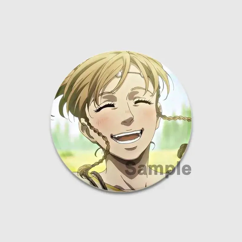 Circular vinland saga thorfinn enamel pin with smiling blonde braided character on green and yellow background, handmade