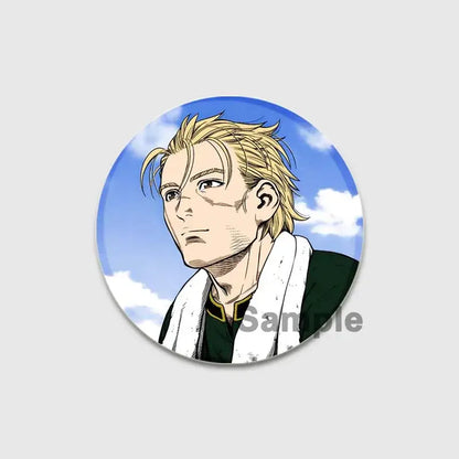 Circular vinland saga thorfinn enamel pin with spiky blonde hair and dark green jacket against blue sky background