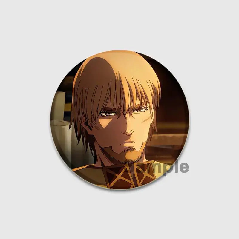 Circular handmade vinyl saga thorfinn enamel pin featuring light brown hair anime character with stern expression in warm tones