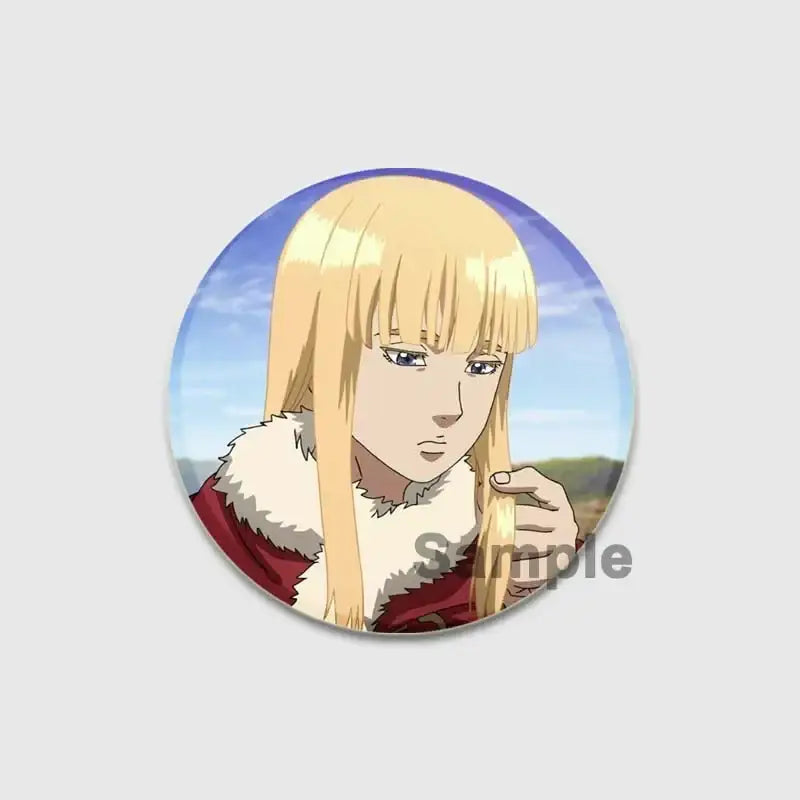 Circular vinland saga thorfinn enamel pin featuring anime character with long blonde hair and red fur trimmed garment