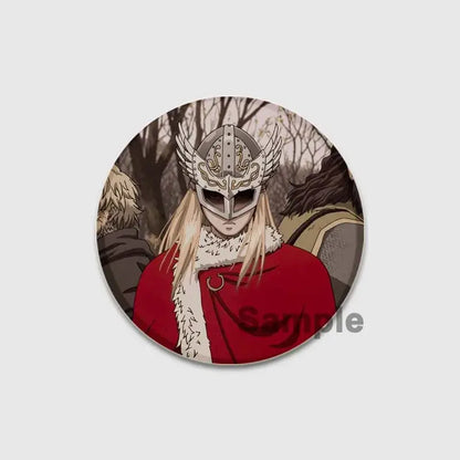 Circular vinland saga thorfinn enamel pin featuring anime character with silver winged helmet and red fur trimmed cloak