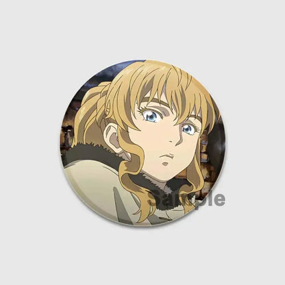 Circular vinland saga thorfinn enamel pin featuring blonde anime character with blue eyes and fur-trimmed light coat