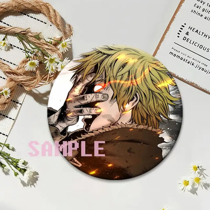 Vinland saga thorfinn round lapel pin features a blonde character with glowing red eyes in dynamic action design