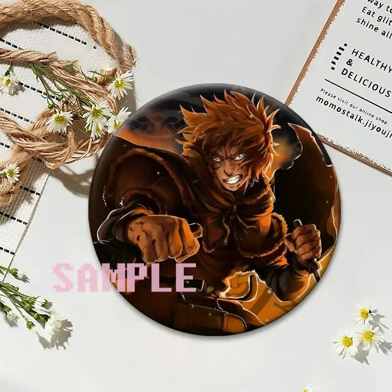 Circular vinland saga thorfinn lapel pin featuring orange-haired anime character in dynamic pose on dark background