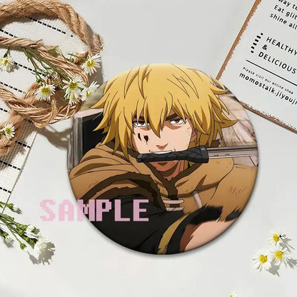 Circular glossy plastic vinland saga thorfinn lapel pin featuring blonde anime character with sword in mouth