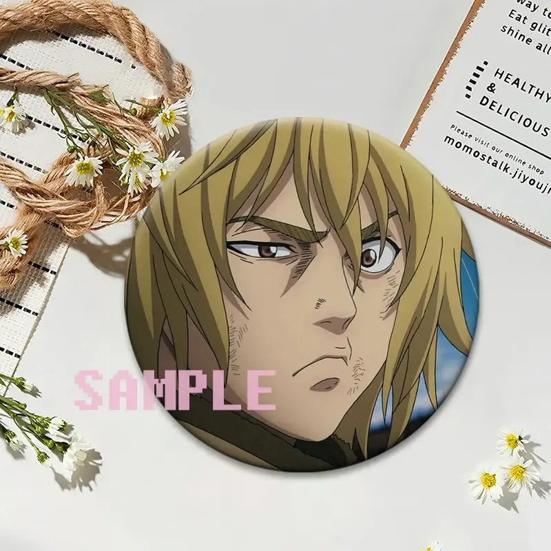 Circular glossy vinland saga thorfinn lapel pin featuring an anime character with blonde hair and brown eyes