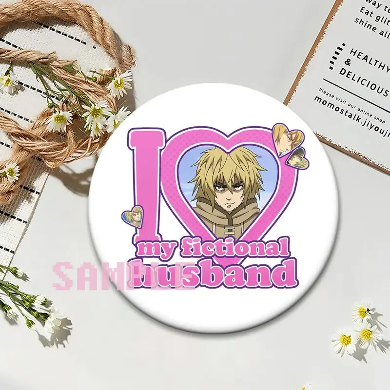 White circular vinland saga thorfinn lapel pin with pink i heart my fictional husband design and anime illustration