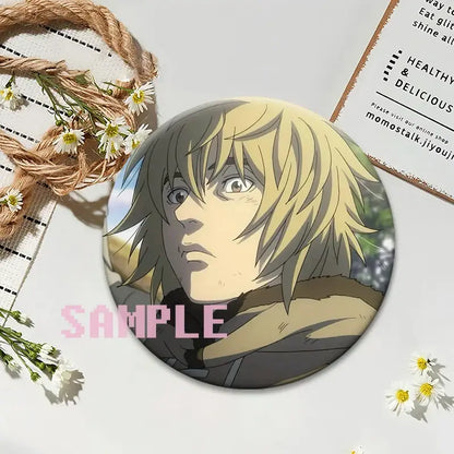Vinland saga thorfinn lapel pin featuring a blonde-haired male with detailed shading on smooth metallic round brooch