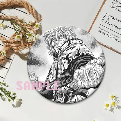Circular black-and-white vinland saga thorfinn lapel pin featuring detailed spiky-haired anime character design