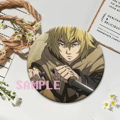 Vinland saga thorfinn lapel pin featuring a round brooch with a blonde anime character holding a sword in both hands