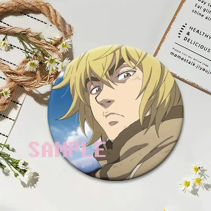 Circular vinland saga thorfinn lapel pin featuring blonde anime character in brown coat against blue sky background