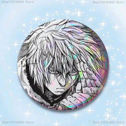 Circular holographic vinland saga thorfinn pin badge featuring black and white anime character with rainbow highlights
