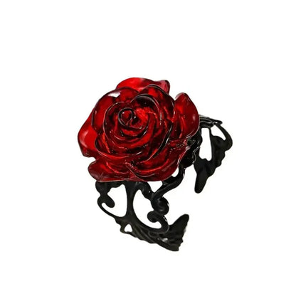 Glossy red rose brooch with intricate black vine filigree detailing inspired by gothic vintage vine ring designs