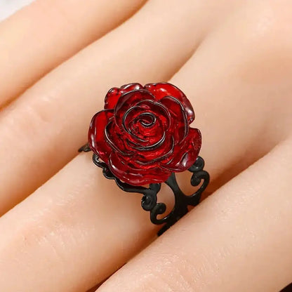Vibrant red rose vine ring with a translucent rose-shaped centerpiece and intricate black vine metal band for gothic style