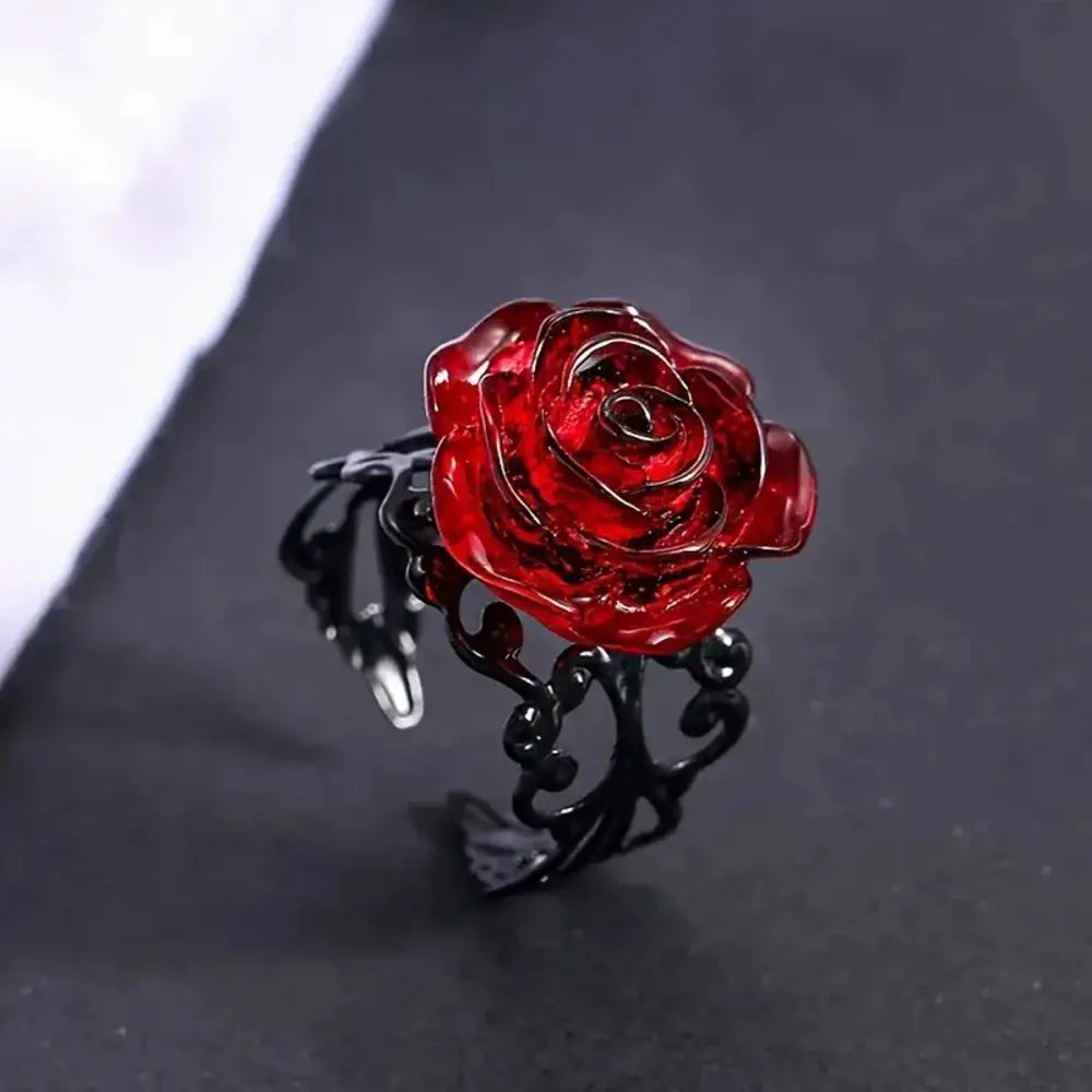 Witch pagan red rose vine ring featuring a glossy red rose on a black vine band with ornate scrollwork vintage gothic jewelry