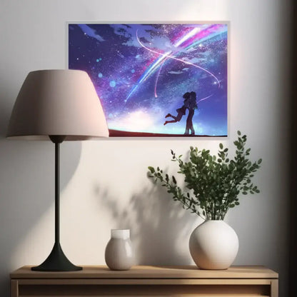 A framed anime-style led night light featuring a couple silhouetted against a vibrant purple and blue cosmic sky