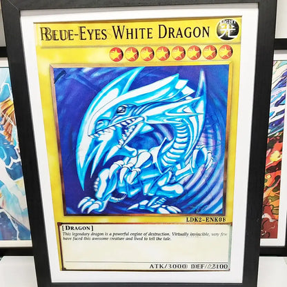 Framed yu-gi-oh blue-eyes white dragon trading card with glowing blue dragon on dark blue background and black frame