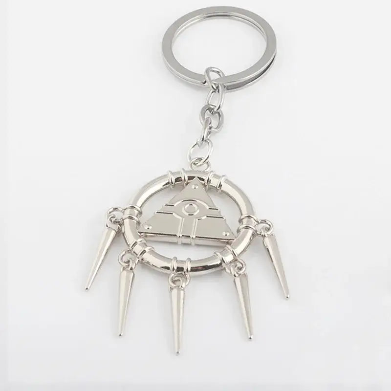 Silver metallic alloy pendant necklace featuring a yu-gi-oh yugi millennium pyramid with eye and five spikes keychain