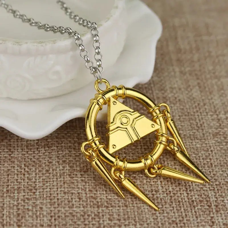 Gold-colored metal pendant necklace featuring yu-gi-oh yugi millennium triangular emblem on silver-toned chain alloy
