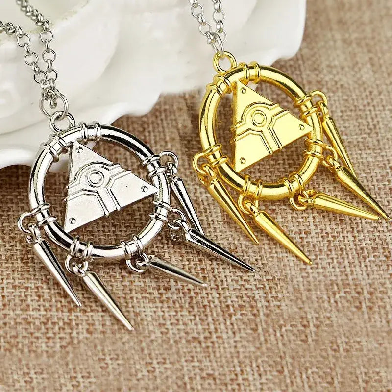 Silver and gold alloy pendant necklace with circular design, engraved triangle, and dangling spiked charms inspired by yu-gi-oh